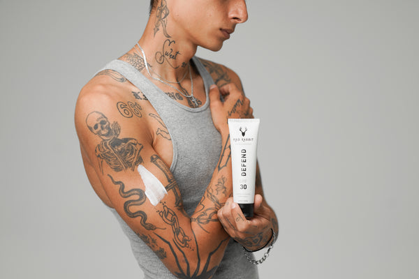 Tattooed arms in golden sunlight